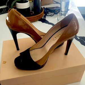 Prada cream and black pumps/heels with open toe